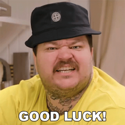 Man In Hat And Yellow Shirt Saying Good Luck GIF