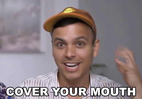 Man in Hat Covering Mouth