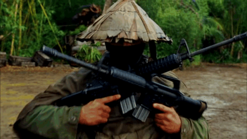 Man In Hat Holding Gun GIF