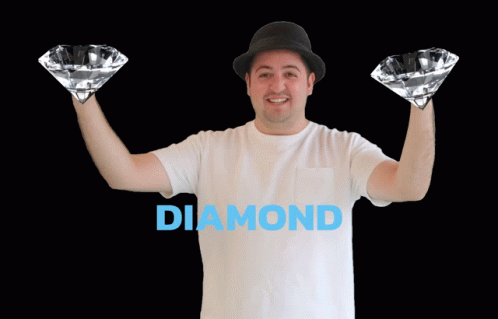 Man in Hat Holding Two Diamonds Diamond Hands