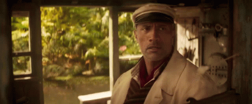 Man in Hat in Front of Window