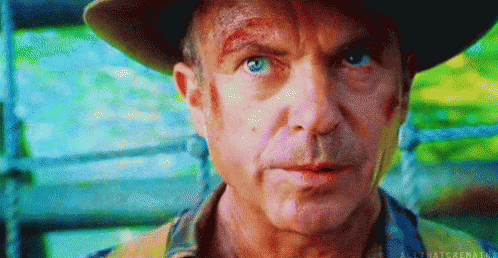 Man In Hat Looking At Camera GIF