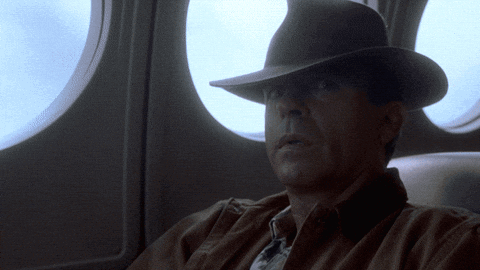 Man In Hat Looking Out Window GIF