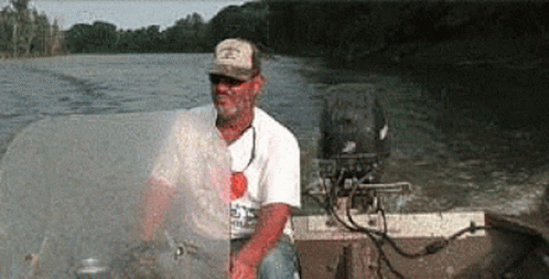 Man In Hat On Motorboat GIF