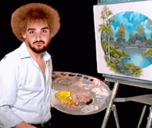 Man in Hat Painting at Easel