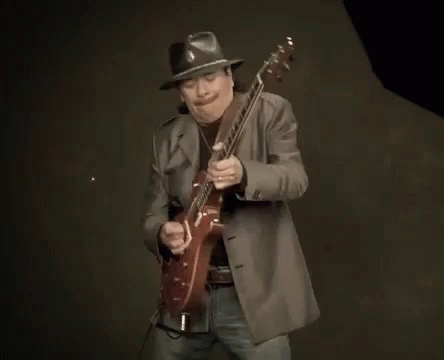 Man in Hat Playing Guitar