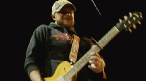 Man In Hat Playing Guitar On Stage GIF