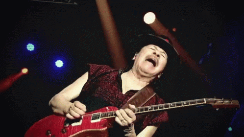 Man In Hat Playing Red Guitar On Stage GIF