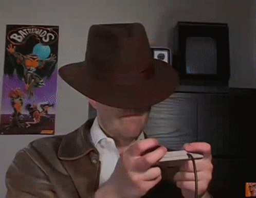 Man in Hat Playing Video Game Battlerios