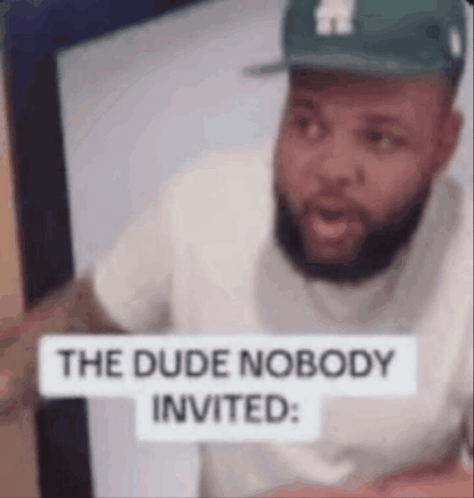 Man in Hat Pointing at Sign The Dude Nobody Invited