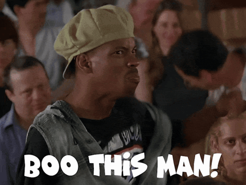 Man in Hat Saying Boo to Crowd
