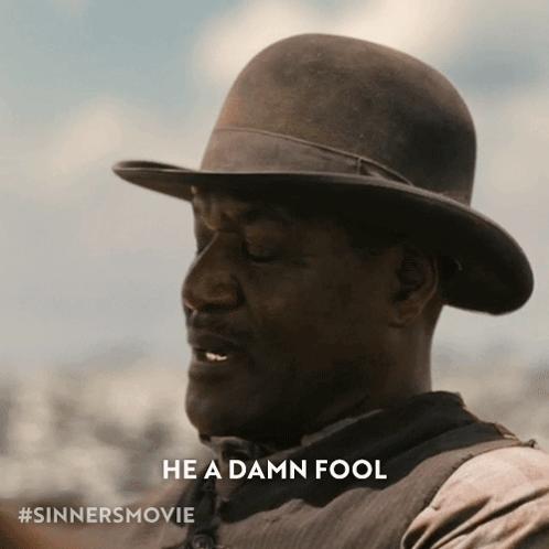 Man in Hat Saying Damn Fool