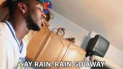 Man in Hat Saying Rain Rain Go Away