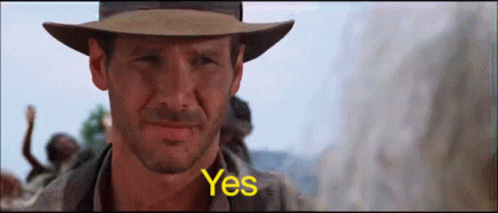 Man in Hat Saying Yes in Front of Crowd