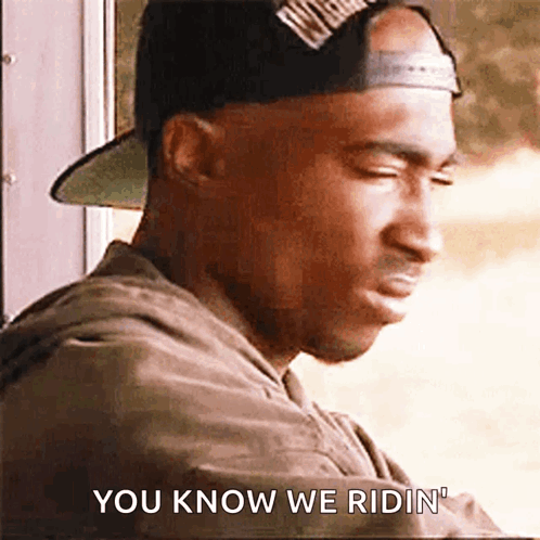 Man in Hat Saying You Know We Ridin