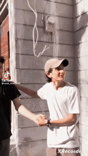 Man In Hat Shaking Hands With Man GIF