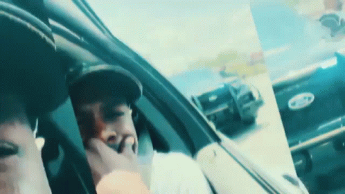 Man In Hat Sitting In Car With Ford Logo GIF