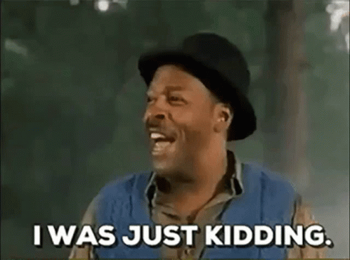 Man in Hat Smiling Saying I Was Just Kidding