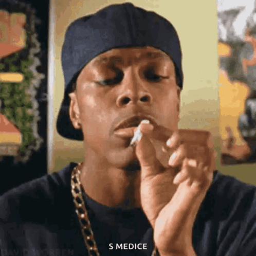 Man In Hat Smoking Cigarette GIF