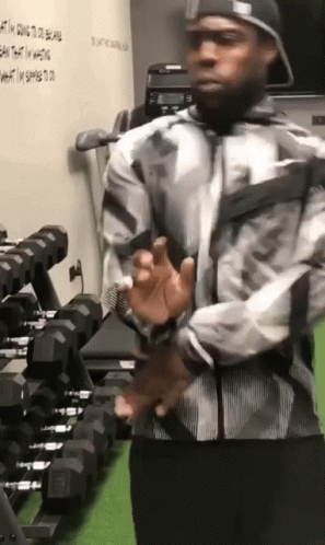 Man In Hat Standing In Gym GIF