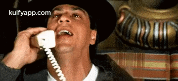 Man in Hat Talking on Phone