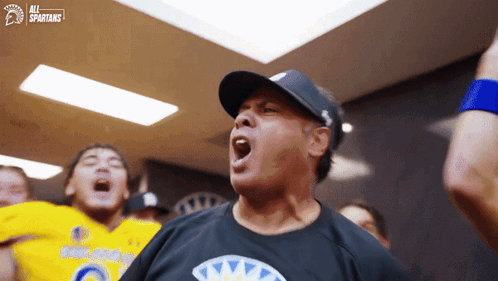 Man in Hat Wearing All Spartans Shirt