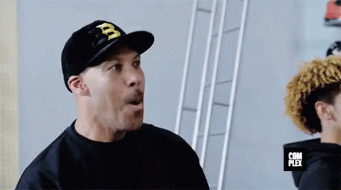 Man in Hat With Letter B Surprised