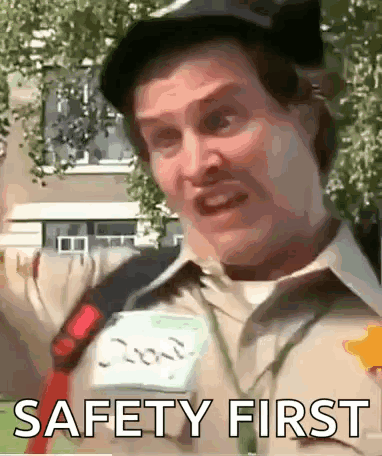 Man in Hat With Name Tag Saying Safety First