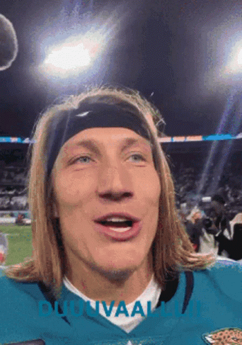 Man In Headband And Jaguars Jersey Looking At Camera GIF