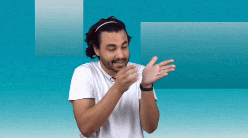 Man in Headband and White Shirt Clapping