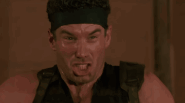 Man in Headband Funny Face in Dark Room