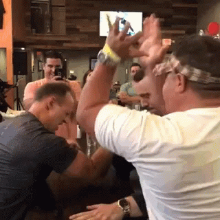 Man in Headband Raising Hands
