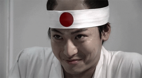 Man In Headband With Red Circle GIF