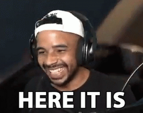 Man In Headphones And Baseball Cap Laughing Here It Is GIF