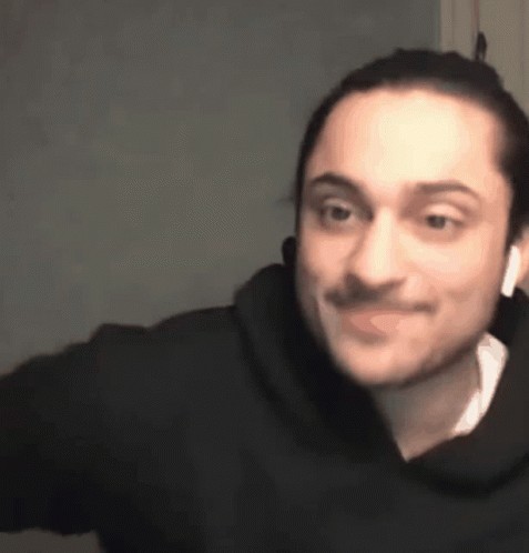 Man In Headphones And Black Hoodie Making Face GIF