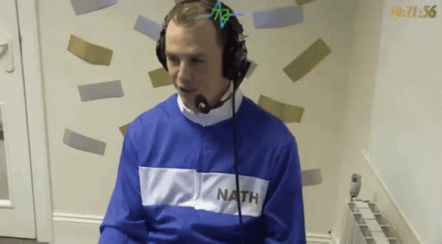 Man in Headphones and Blue Sweater With Nath