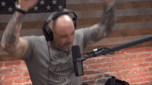 Man in Headphones and Brooklyn T-Shirt Dancing