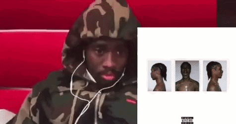 Man In Headphones And Camouflage Hoodie On Red Chair GIF