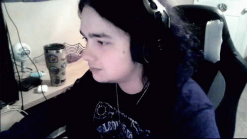 Man in Headphones and Falcons Shirt