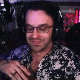 Man In Headphones And Glasses Smiling At Microphone GIF