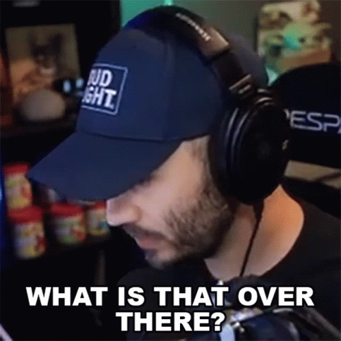 Man In Headphones And Hat Saying What Is That Over There GIF