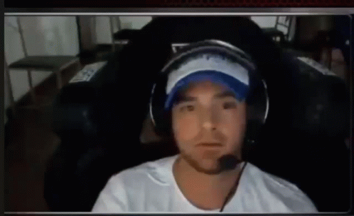 Man in Headphones and Hat Thumbs Up