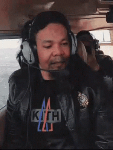 Man in Headphones and Kith T-Shirt