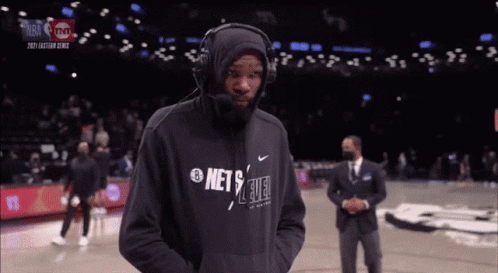 Man In Headphones And Nets Sweatshirt GIF