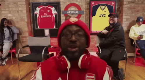 Man In Headphones And Red Arsenal Jacket GIF
