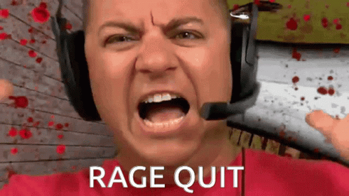 Man in Headphones and Red Shirt Screaming Rage Quit