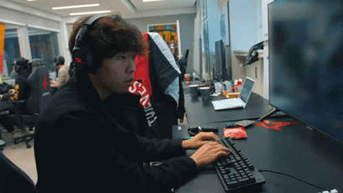Man in Headphones and Supreme Shirt Typing