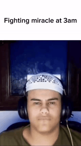 Man in Headphones and White Headband Fighting Miracle at 3am