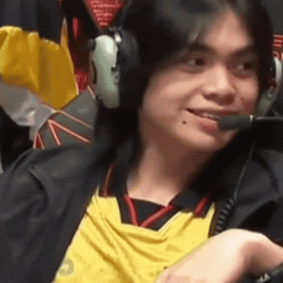 Man In Headphones And Yellow Shirt Smiling Into Microphone GIF