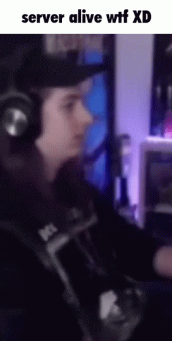 Man in Headphones at Computer with Server Alive WTF XD